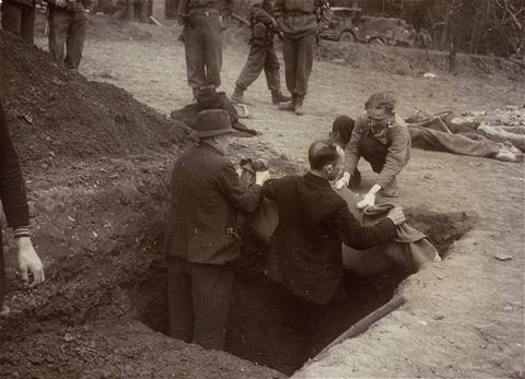 A Polish man, Walter Kallaur and his son, Michael, bury the boy's grandmother